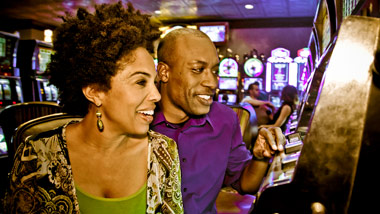couple playing casino slots