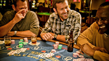 3 guys playing blackjack