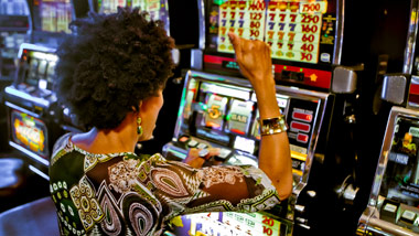 woman winning at casino slot machine