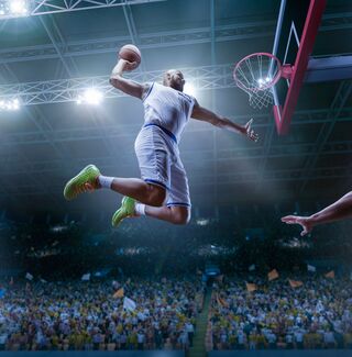 Basketball player going up for a dunk
