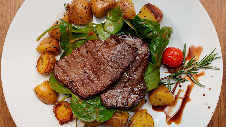 steak, potatoes and spinach